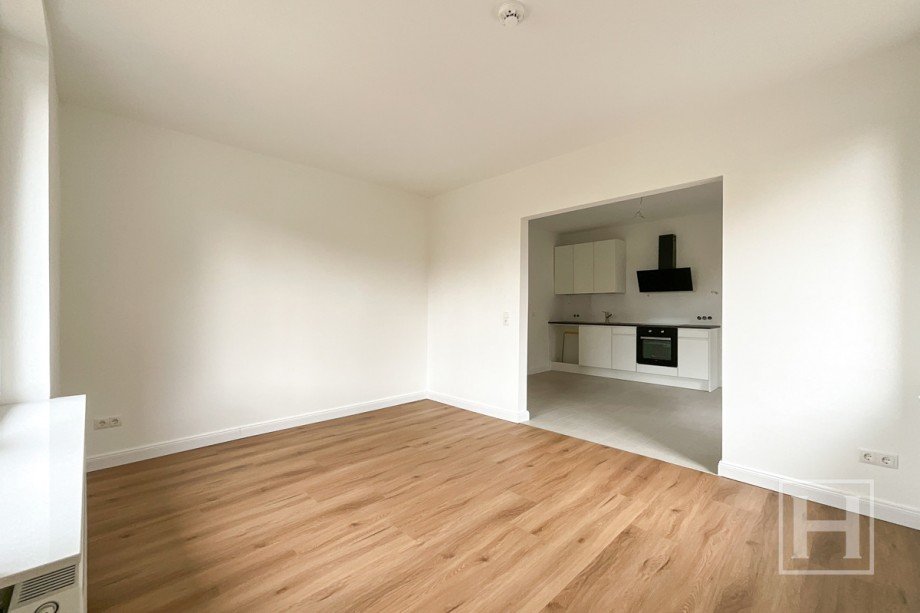 Gem�tlicher Wohnbereich mit Durchgang zur K�che Erdgeschosswohnung Stuvenborn