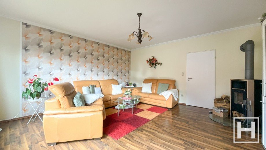 Wohnzimmer mit Kamin im Erdgeschoss Einfamilienhaus Seth